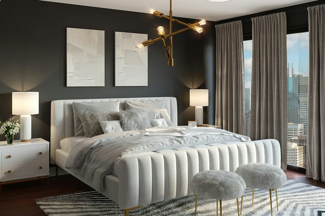 Chambre élégante, tête de lit capitonnée et rideaux sombres