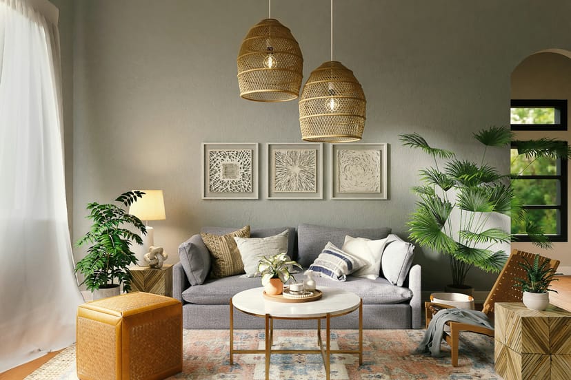 Salon aux suspensions en rotin, canapé gris et plantes vertes